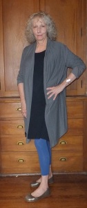 Ann Taylor is wearing a navy-blue knit dress and gray cotton hoody jacket from Muji, with bright-blue leggings, silver ballet shoes, and a sterling bracelet perhaps made by her mother.